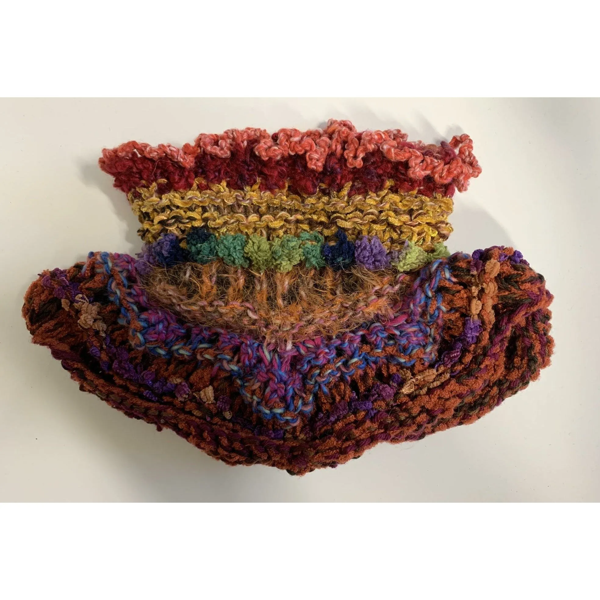 Handknit circular neck scarves in many colors and knit stitches to lend lots of textures and warmth