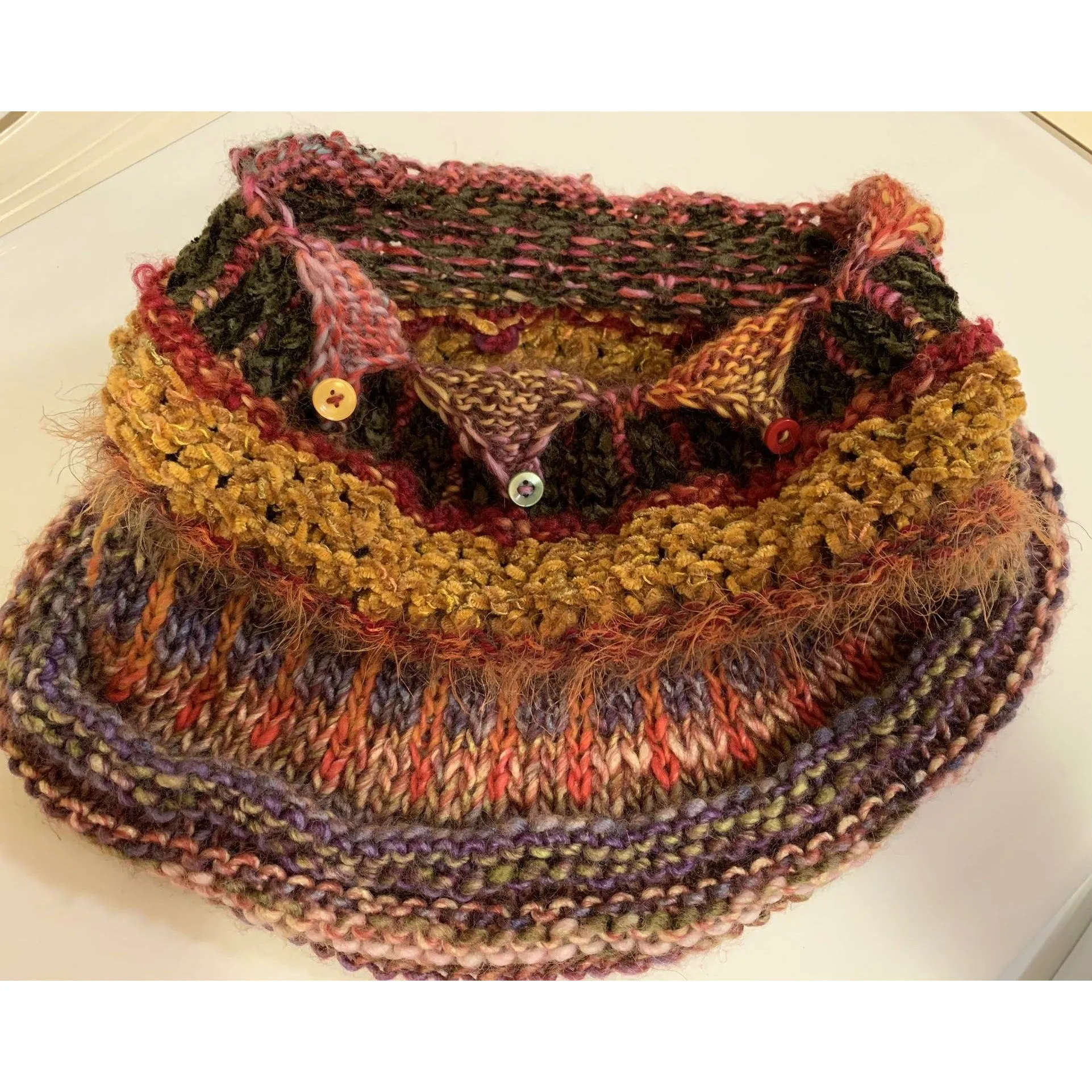 Handknit circular neck scarves in many colors and knit stitches to lend lots of textures and warmth